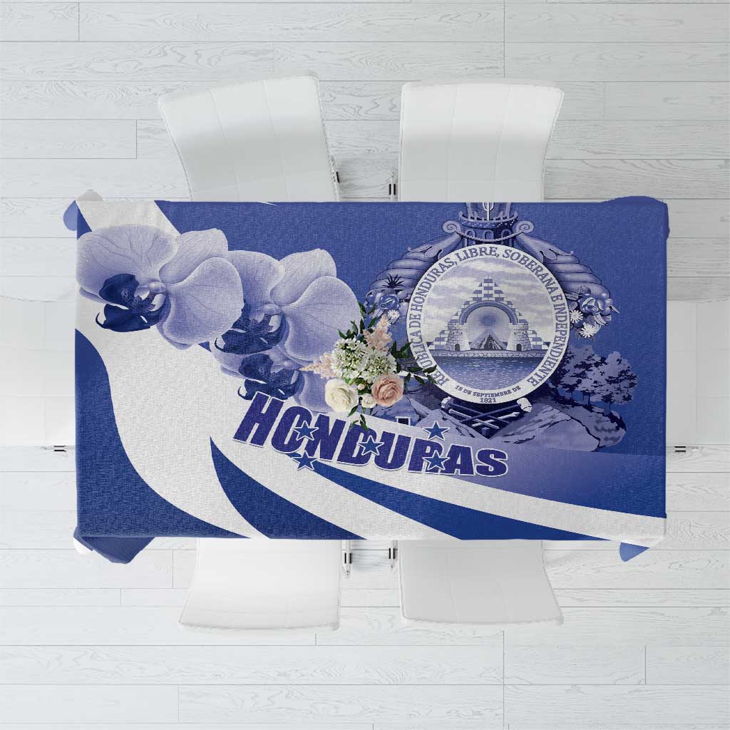 Navy blue tablecloth with white diagonal stripes, orchids, and Honduras emblem