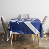 Navy blue tablecloth with white diagonal stripes and Honduras emblem on a table