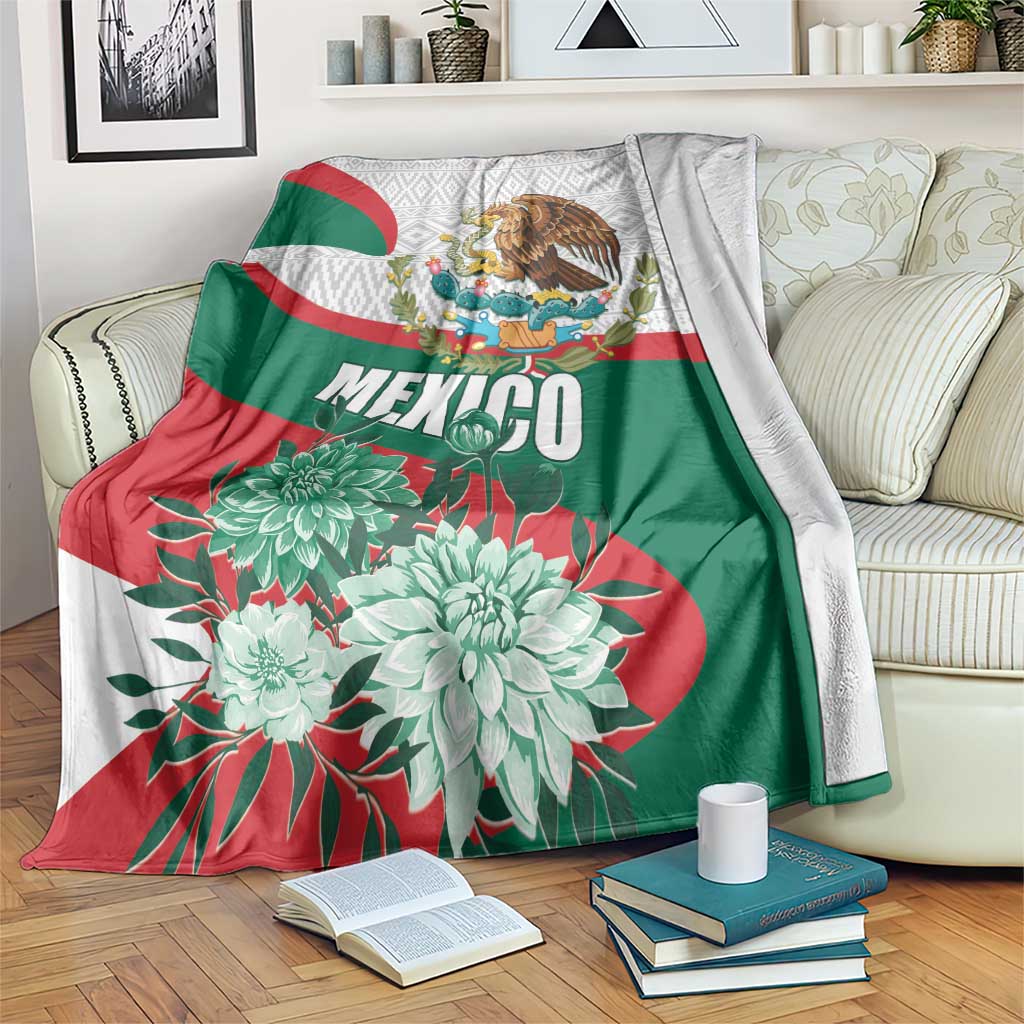 Mexico-themed blanket draped over a couch with MEXICO text, eagle, and floral design