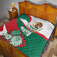 Mexico-themed quilt draped on bed featuring eagle emblem, “Mexico” text, and floral bouquet