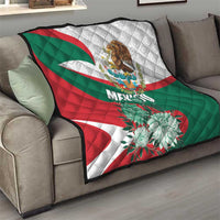 Mexico-themed quilt on sofa showing green, red, and white flag colors with eagle and flowers