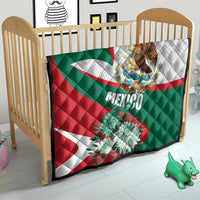 Mexico-themed quilt on crib with eagle crest, “Mexico” text, and large teal flower print