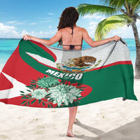 Mexico-themed sarong worn wrap style, eagle emblem and flowers on white with red-green