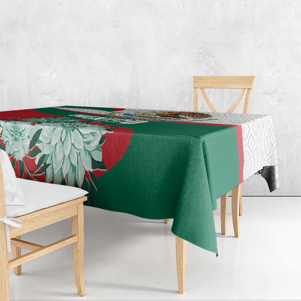 Tablecloth with green center, red floral stripe, and Aztec-style edge motifs