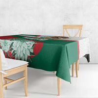 Tablecloth with green center, red floral stripe, and Aztec-style edge motifs
