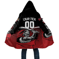 Cricket hoodie cloak back, black hood with large red-and-black shield graphic, long cape