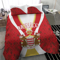 Red bedding set with large Monaco logo, two red diamond-pattern pillowcases and duvet