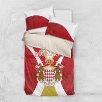 Red duvet and pillow shams with Monaco crown crest, white and yellow stripe accents