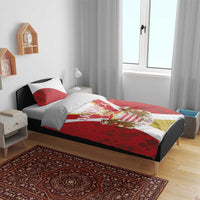 Red bedding set with Monaco crest and striped duvet, shown on a single bed