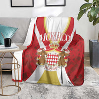 Red and white Monaco print blanket with crown and coat-of-arms center