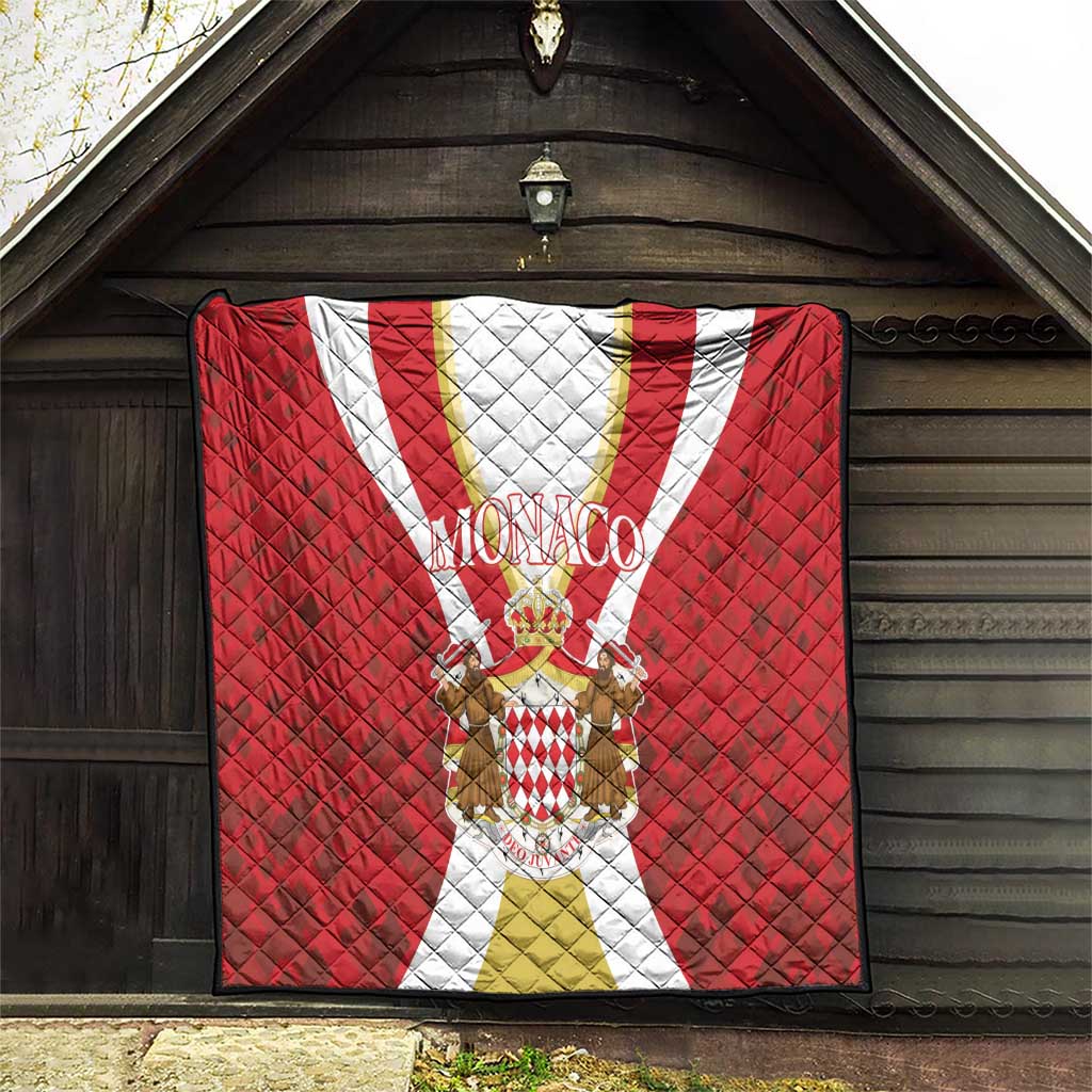 Red Monaco quilt hanging display with quilted diamond texture, crest emblem and white-gold stripe