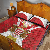 Monaco quilt bed set with red quilt, white center panel, crest artwork, and two pillowcases