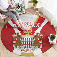 Red round carpet with large Monaco title and crest, framed by gold border