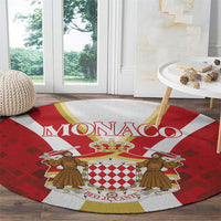 Red round carpet with Monaco crest and two courtiers over chess shield