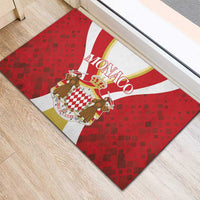 Red rubber doormat with central Monaco crest, crown, and white stripe banner