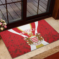Red rubber entrance doormat with Monaco crest, crown and figures on red patterned background