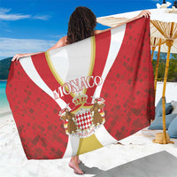 Red Monaco sarong with white and gold curved stripes and crest graphic