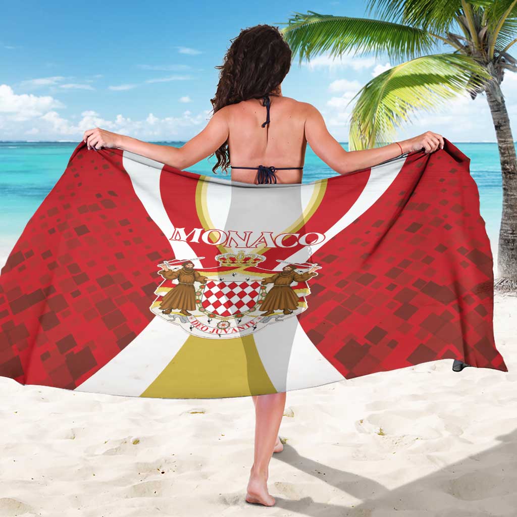 Red Monaco sarong fully spread flat, with crest graphic and bold curved stripes