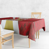 Red tablecloth with gold and white panel blocks and dark geometric pattern