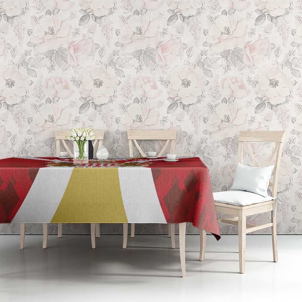 Red tablecloth with gold center panel and white side sections, geometric motif pattern