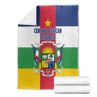 Central African Republic flag-style blanket stacked with white towels, crest centered