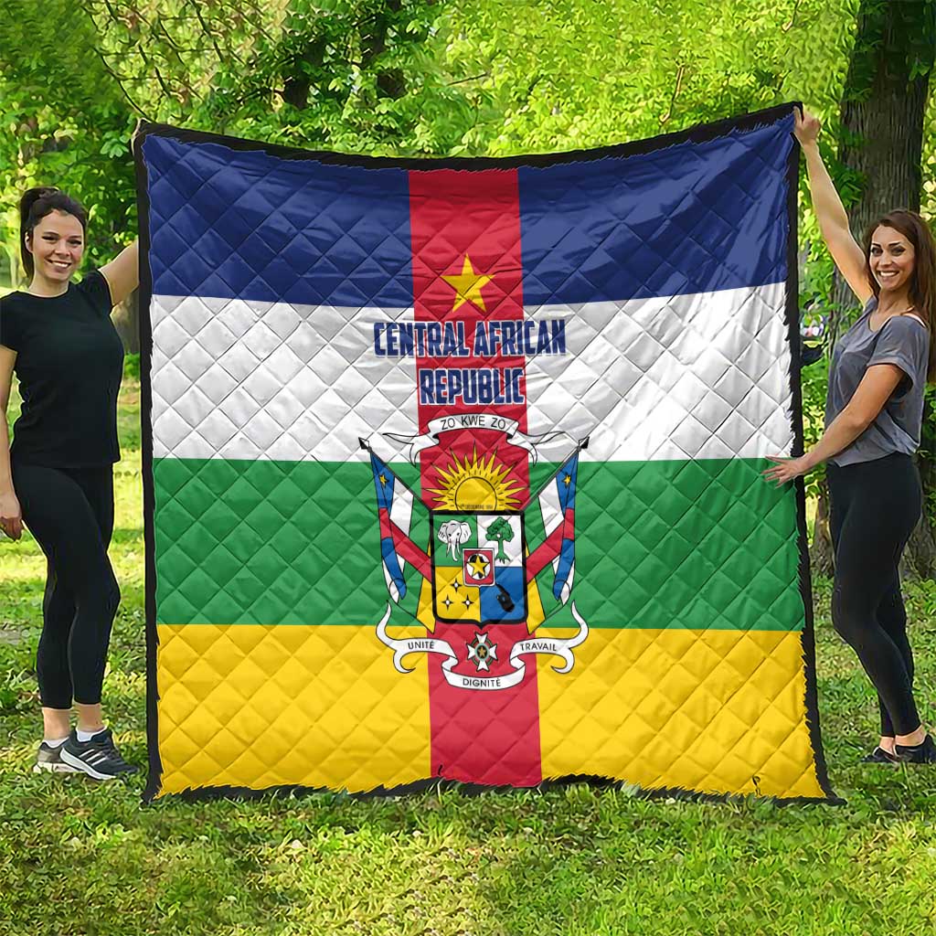 Central African Republic flag quilt draped outdoors, quilted diamonds with national crest