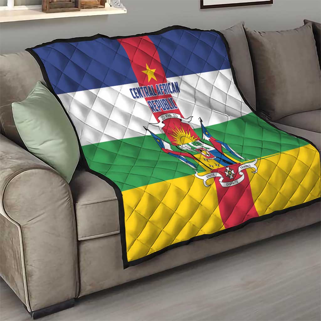 Central African Republic flag quilt on sofa, quilted diamonds with crest over flag colors