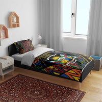 Black bedding set with colorful geometric African design and large central emblem