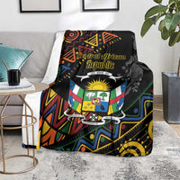 Black patterned blanket draped on sofa, showing Central African Republic shield and graphics