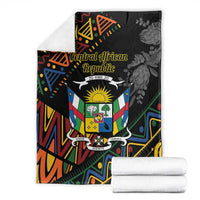 Black patterned blanket with Central African Republic text logo, crest, and flower accents