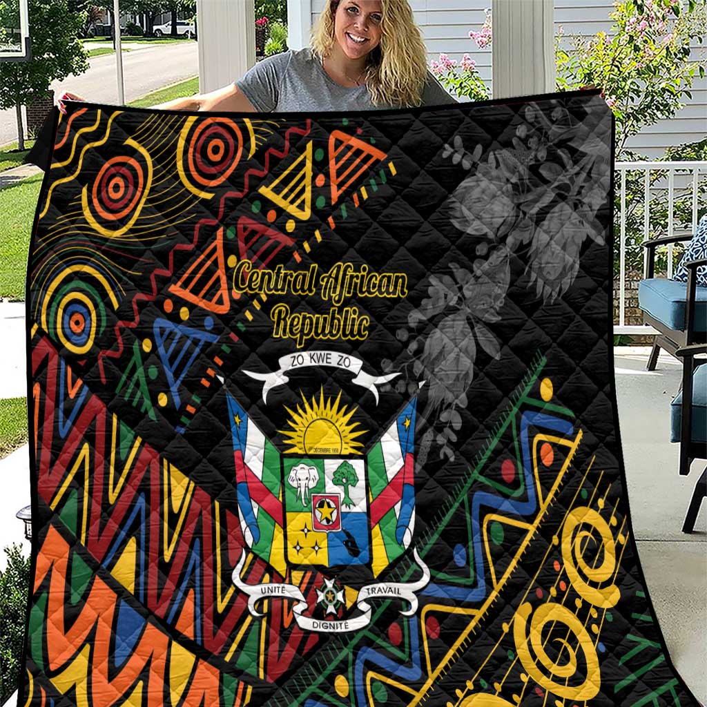 Black quilt with Central African crest panel and colorful geometric tribal patterns, quilted surface