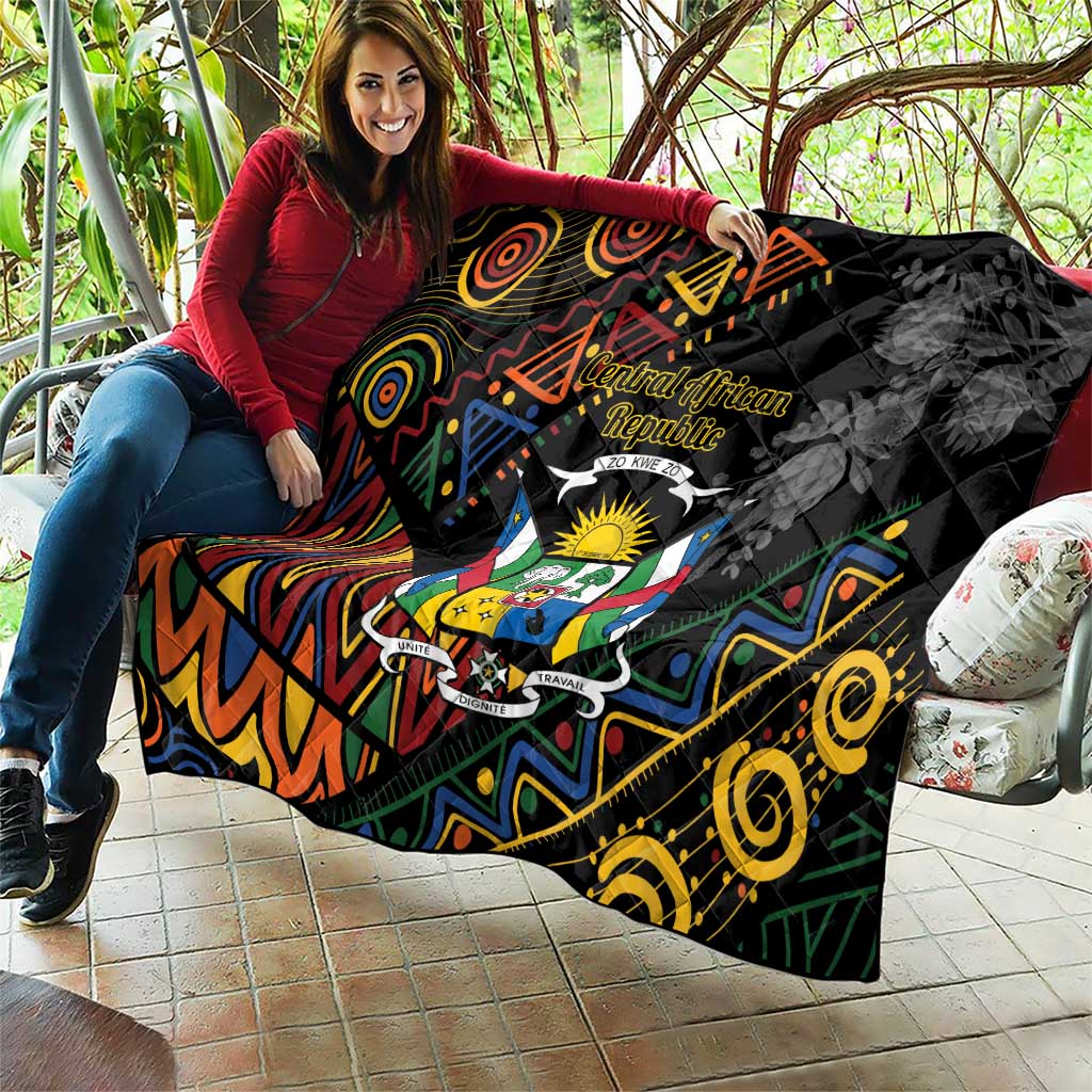 Black quilt blanket with Central African crest and bold colorful tribal motifs, quilted fabric