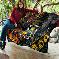 Black quilt blanket with Central African crest and bold colorful tribal motifs, quilted fabric