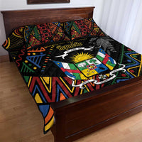 Black quilt bed set with multicolor crest graphic and geometric patterns, two pillows