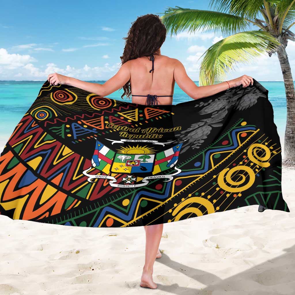 Black wrap sarong with crest shield and bold geometric tribal motifs