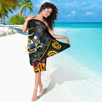 Black sarong with colorful tribal graphics and light gray protea-style print