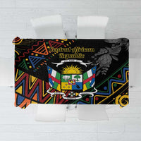 Black tablecloth with multicolor geometric African crest pattern, rectangular drape.