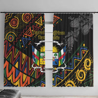 Black window curtains pair with colorful emblem center and swirly geometric borders