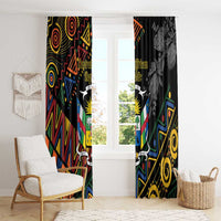 Black window curtains with colorful geometric center panel and grayscale floral right panel