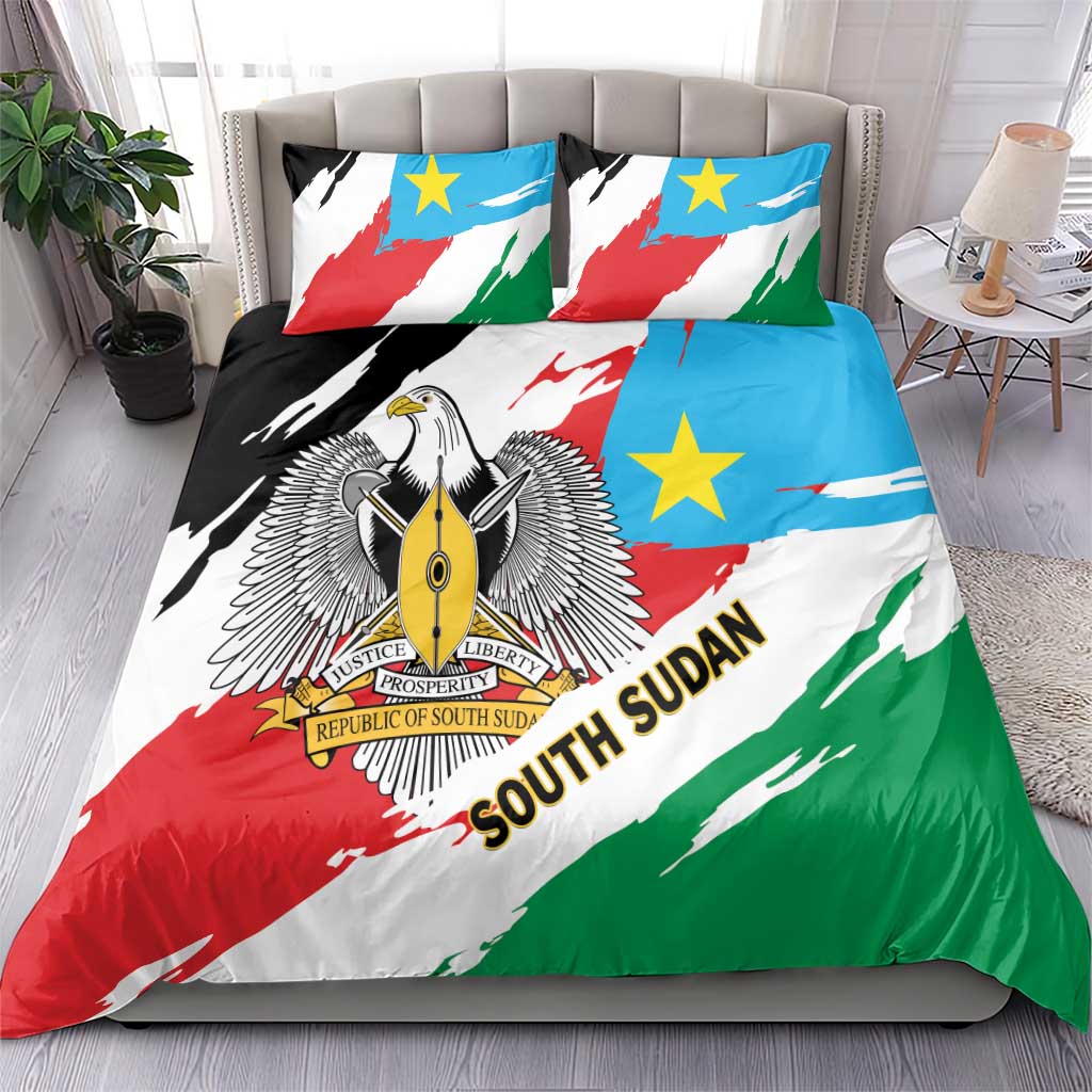 South Sudan bedding set on bed with flag-pattern duvet and two accent pillow shams