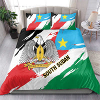 South Sudan bedding set on bed with flag-pattern duvet and two accent pillow shams