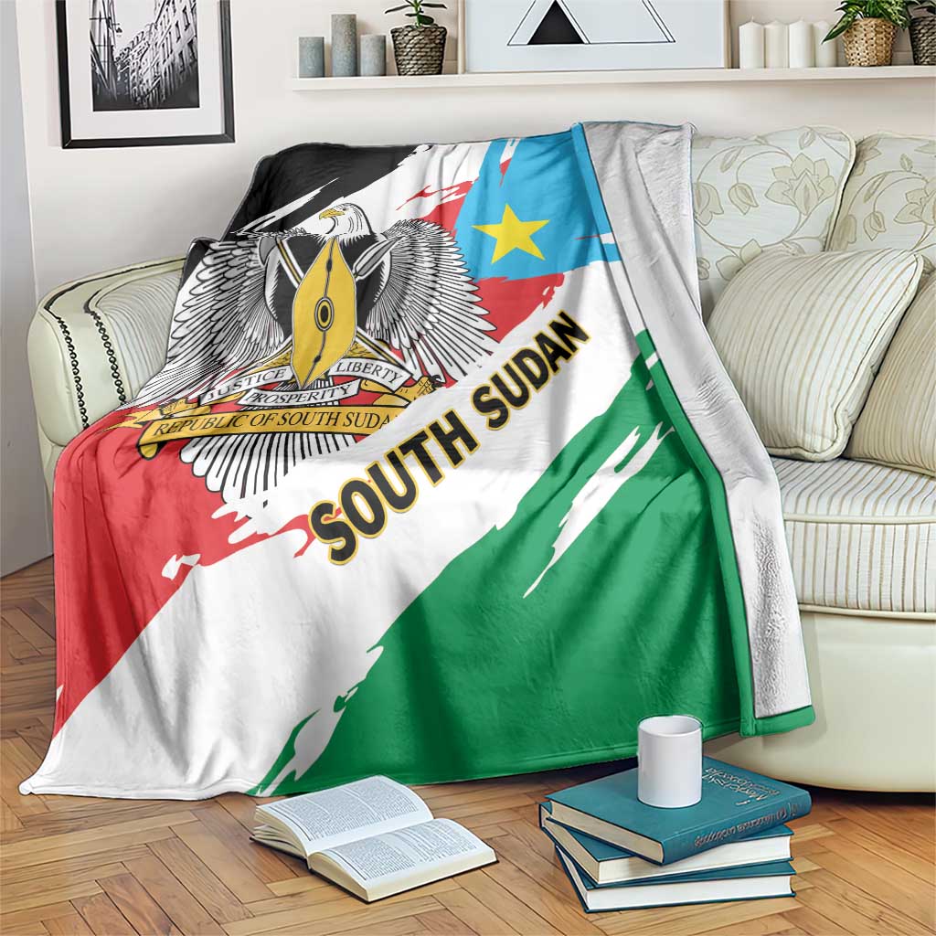 Flag-themed throw blanket with eagle crest, blue star, and red-green diagonal stripes
