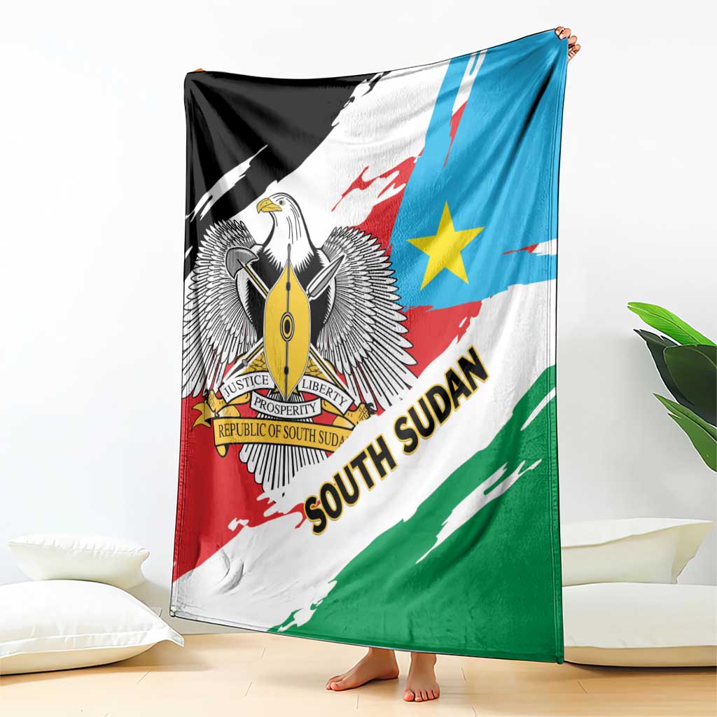 Flag-themed throw blanket draped with eagle emblem, blue star, and red-green diagonal bands