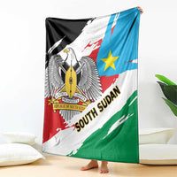 Flag-themed throw blanket draped with eagle emblem, blue star, and red-green diagonal bands