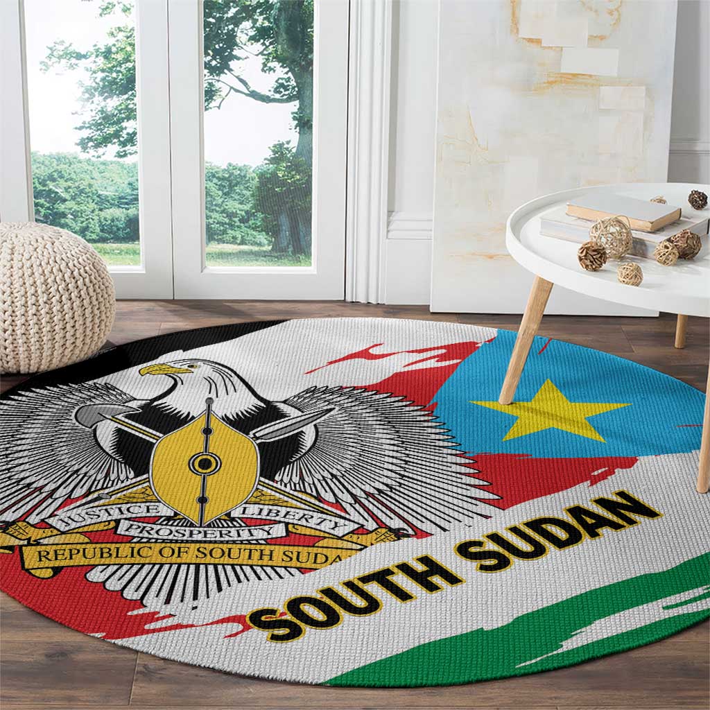 Round area rug with South Sudan flag emblem, blue star, and green border stripes