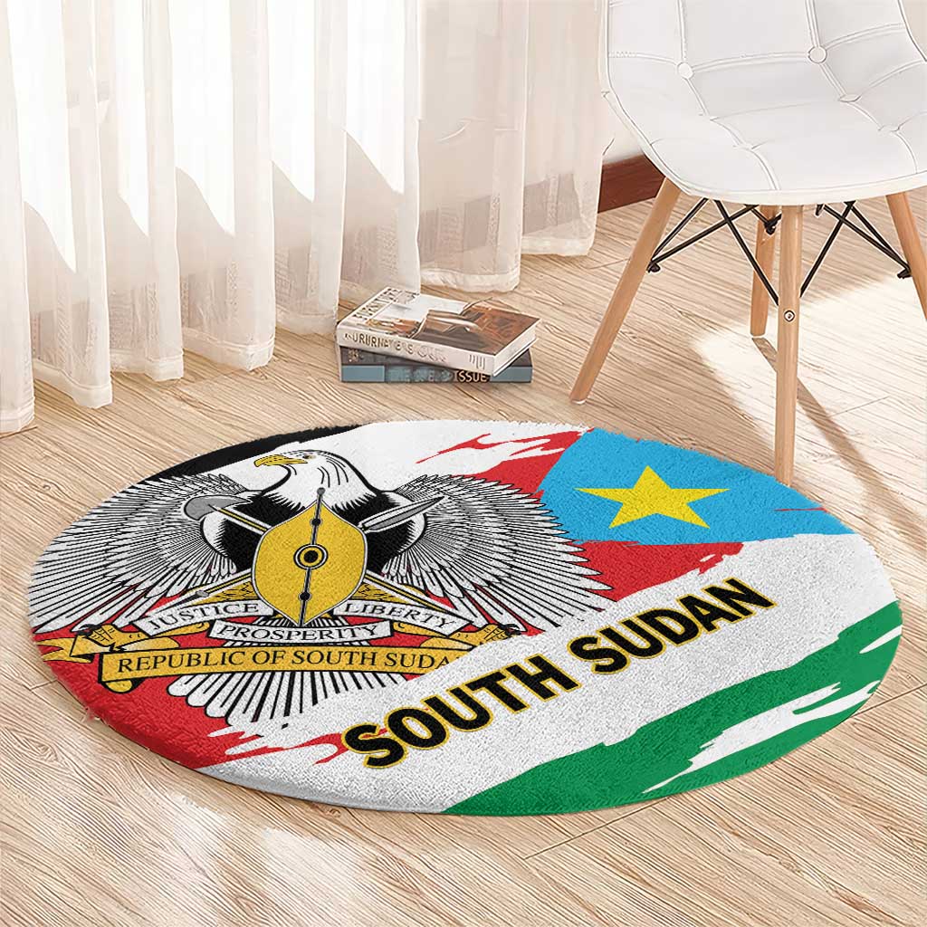 Round area rug with South Sudan flag design, emblem, blue star, and “SOUTH SUDAN”