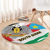 Round area rug with South Sudan flag design, emblem, blue star, and “SOUTH SUDAN”