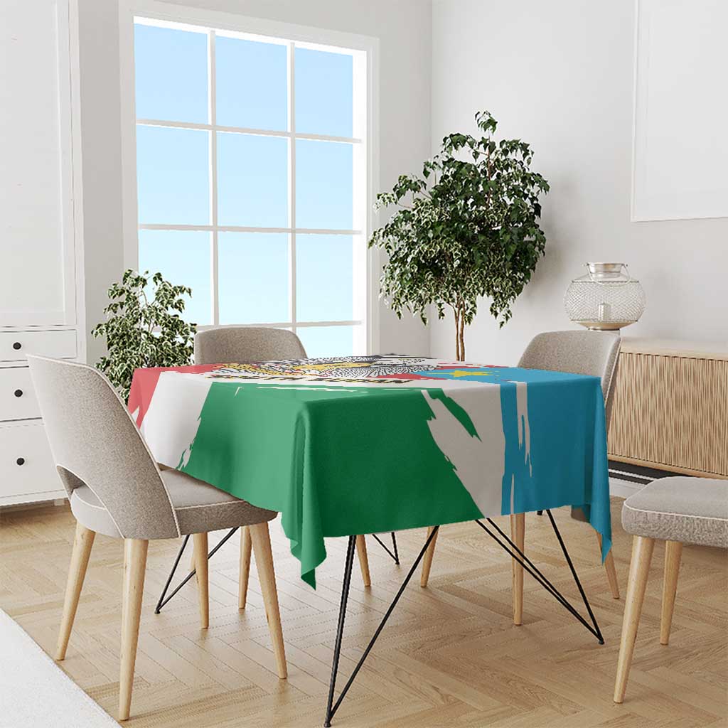 South Sudan flag grunge tablecloth draped on dining table, green blue and red with white