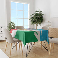 South Sudan flag grunge tablecloth draped on dining table, green blue and red with white