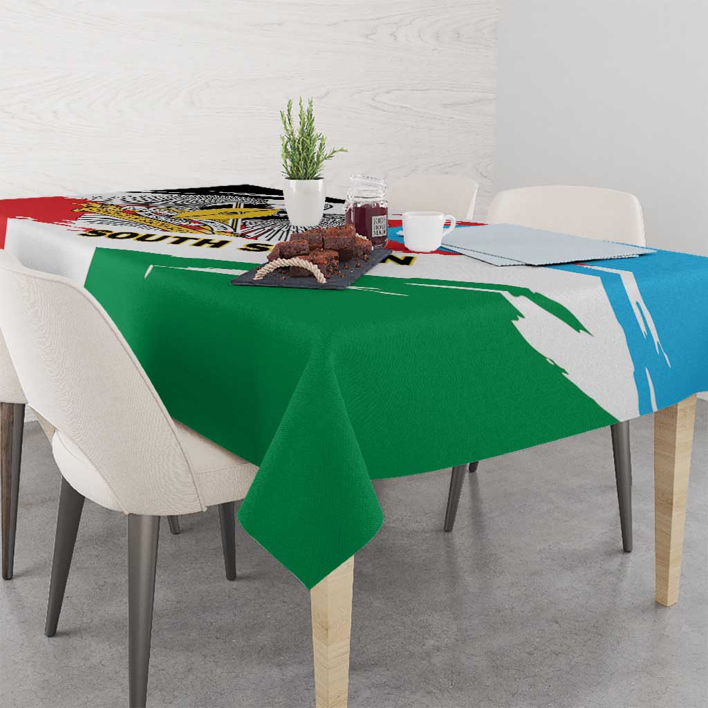 South Sudan flag grunge tablecloth on table, green with blue stripe and red panel